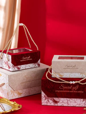 Hộp đựng quà kỷ niệm gấp gọn cứng cáp, cửa sổ trong suốt nắp nam châm, quai thừng đỏ mix ngọc trang nhã